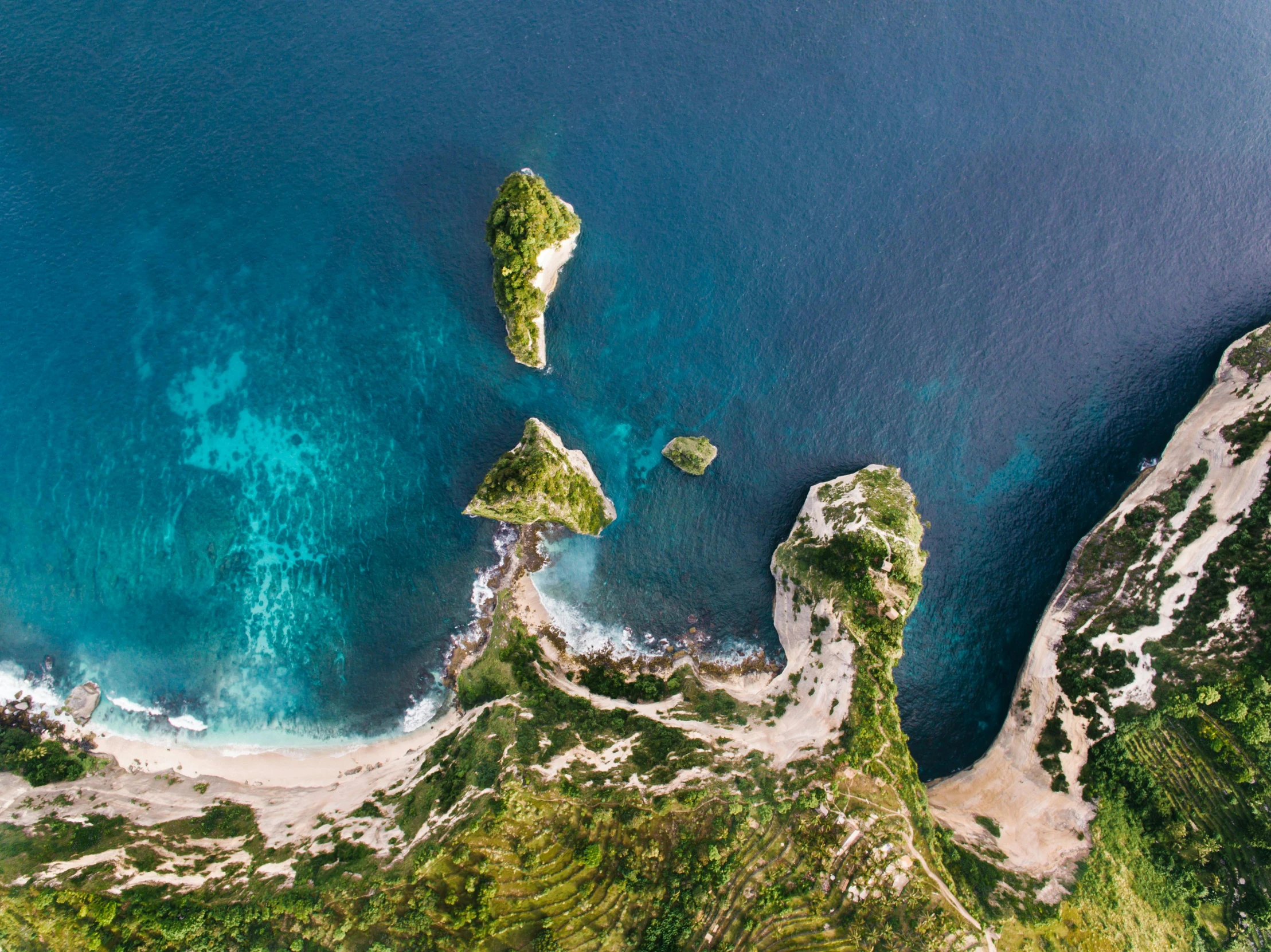 an aerial view of a beach and a body of water, pexels contest winner, renaissance, scylla and charybdis, skull island, mami wata, vivid landscape