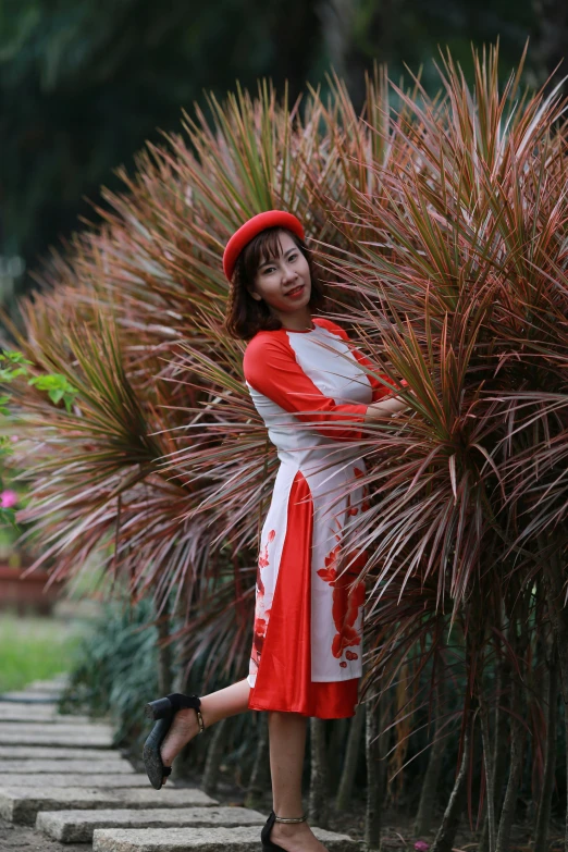 a woman in a red and white dress posing for a picture, inspired by Cui Bai, happening, ao dai, february), avatar image