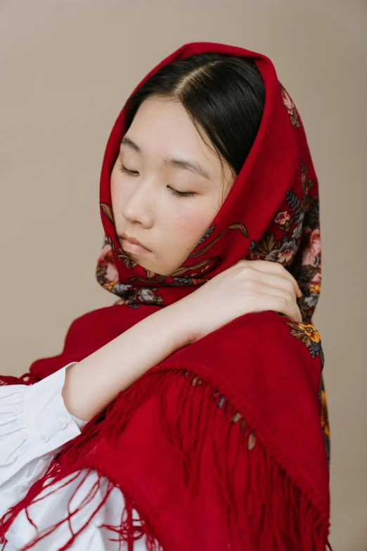 a woman wearing a red shawl and a white shirt, inspired by Jin Nong, trending on pexels, russian, bashful, product shot, woman model