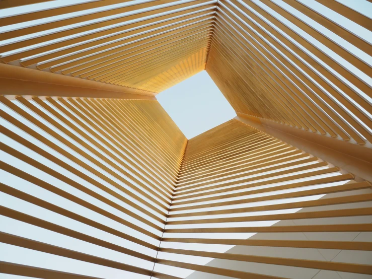 a wooden structure with a sky in the background, inspired by Zha Shibiao, unsplash, light and space, square facial structure, sundial, pine, japan. volumetric lighting