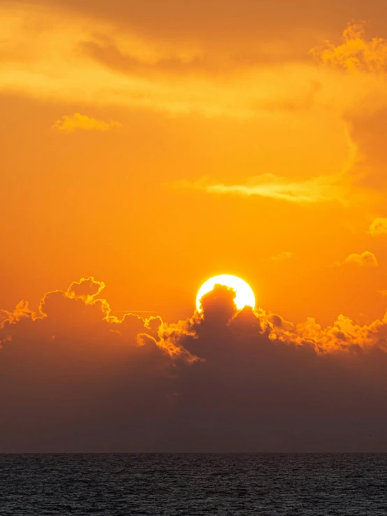 the sun is setting on the horizon of the ocean, pexels contest winner, romanticism, bright yellow and red sun, sunlight through cumulus, slide show, ((sunset))