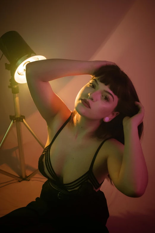 a woman in a black dress posing for a picture, inspired by Elsa Bleda, lighting her with a rim light, sasha grey, in a photo studio, cynthwave
