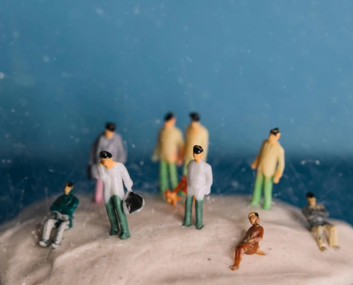 a cake with figurines of people on top of it, by Lee Loughridge, trending on unsplash, figuration libre, covered in white flour, people in beach, people waiting in bus stop, 9 0 mm studio photograph tiny