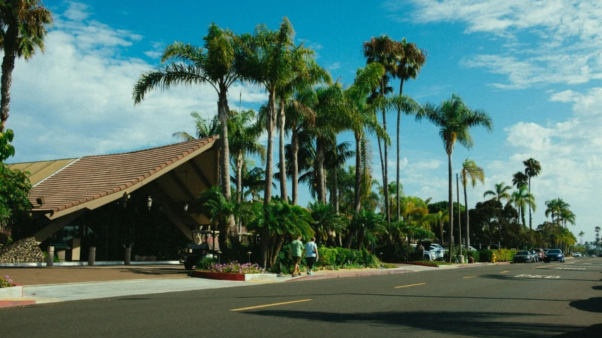 a street lined with palm trees next to a building, recreation, golden arches, martin sandiego, fan favorite