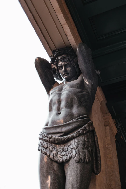 a statue of a man hanging from the side of a building, doing a hot majestic pose, saturno buttò, ornate hair, looking off into the distance