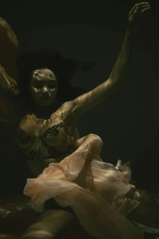 a woman floating under water in a pink dress, video art, weta fx, lady dimitrescu, shot with sony alpha, **cinematic