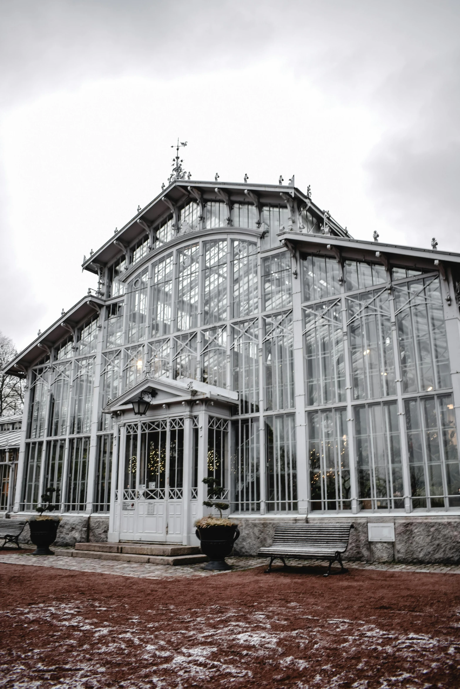 a large glass house sitting on top of a snow covered field, unsplash, art nouveau, exterior botanical garden, 2 5 6 x 2 5 6 pixels, buenos aires, concert hall