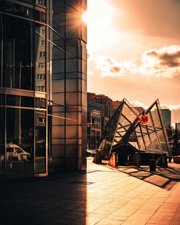 a man riding a skateboard down a sidewalk next to a tall building, an abstract sculpture, by Sebastian Spreng, pexels contest winner, modernism, sun rising, geodesic building, cyberpunk bus stop, today\'s featured photograph 4k