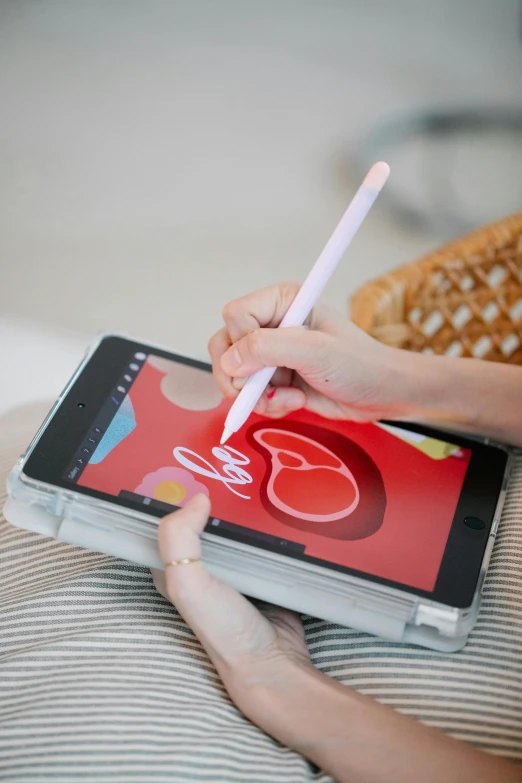 a person sitting on a bed writing on a tablet, by Julia Pishtar, holographic case display, fine point pen, thumbnail, diy