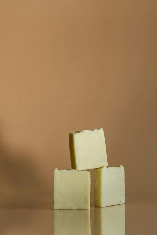 three soap bars stacked on top of each other, by Jessie Algie, soft light - n 9, thumbnail, single, caucasian