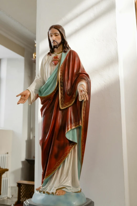 a statue of jesus on a pedestal in a room, by Daniel Lieske, pexels, 15081959 21121991 01012000 4k, multi - coloured, centered shoulders up view, blessing hands