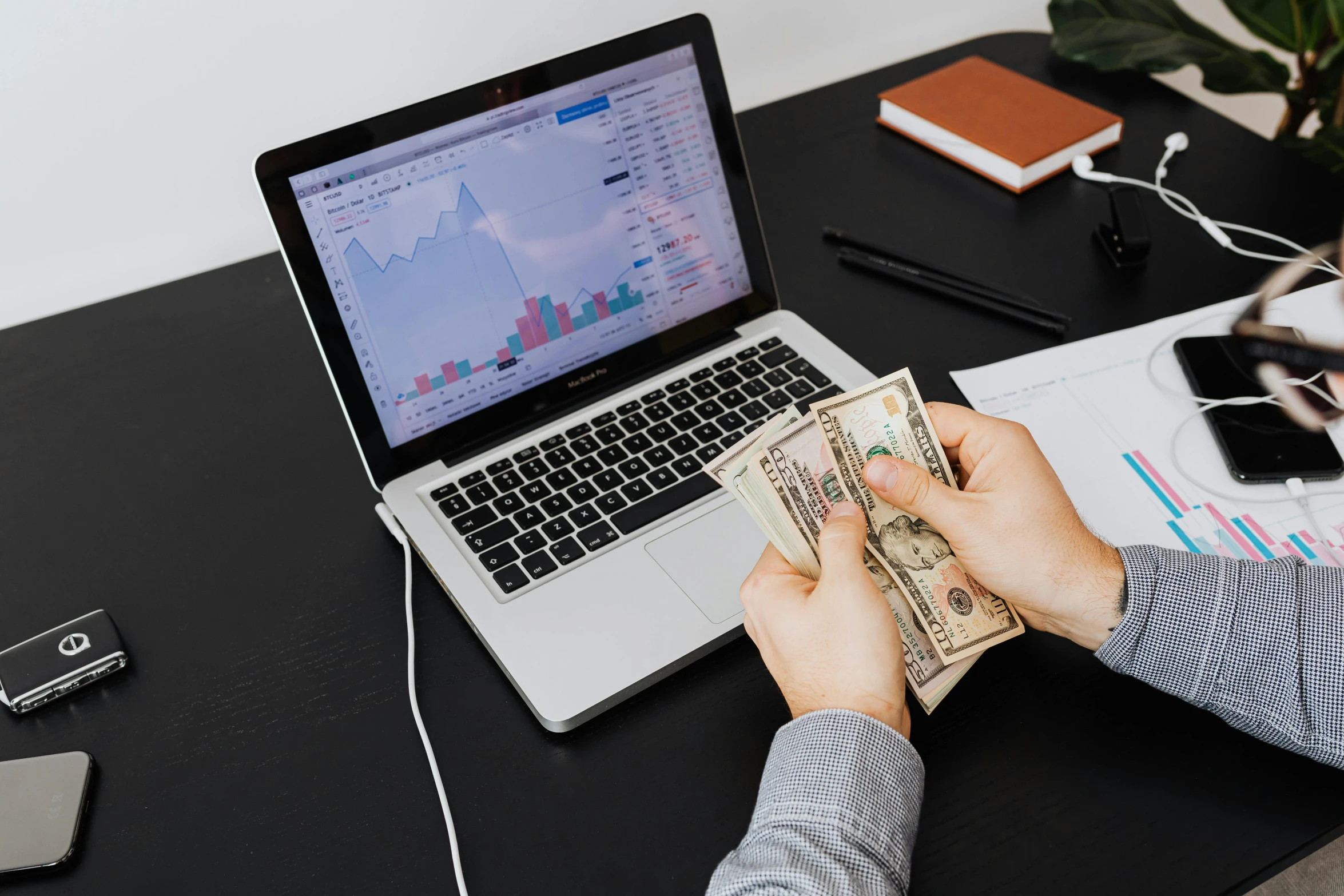 a person sitting at a desk with a laptop and money, pexels contest winner, analytical art, thumbnail, 1 0, modeled, half image