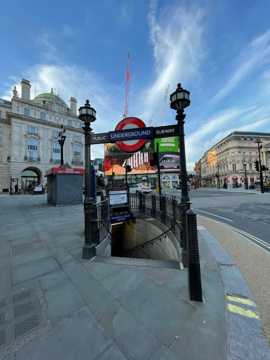 a clock tower sitting on the side of a road, london underground tube station, photo from 2022, on a great neoclassical square, profile image