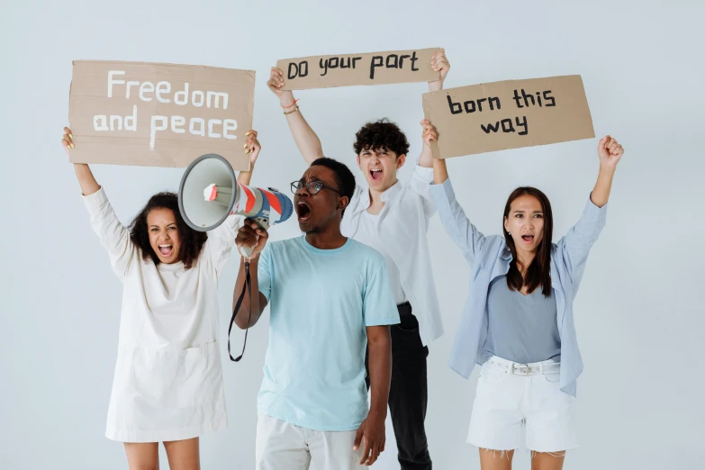 a group of young people holding up signs, by Matija Jama, trending on pexels, avatar image, freedom, background image, diverse costumes