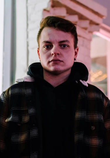 a man standing in front of a building at night, connor hibbs, profile image, mrbeast, headshot profile picture