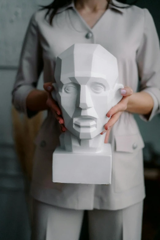 a woman holding a paper sculpture of a man's face, analytical art, 3 d print, geometry, no - text no - logo, trending on art