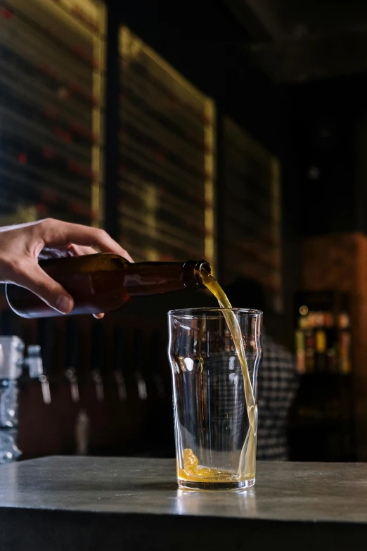 a person pouring a beer into a glass, by Matt Cavotta, pexels, renaissance, chinatown bar, but minimalist, screensaver, college