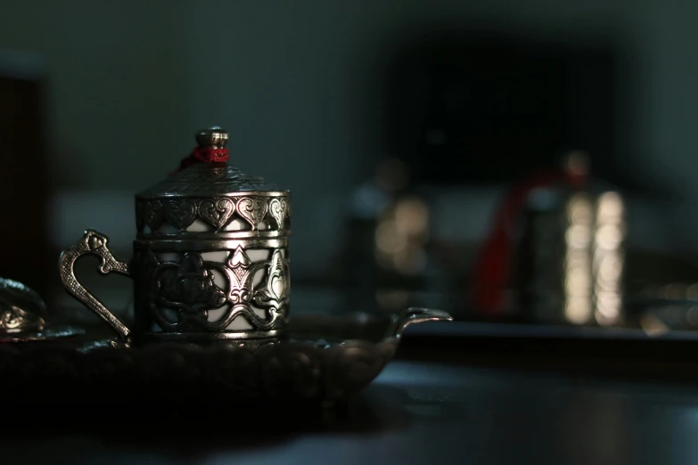 a silver tea pot sitting on top of a table, pexels contest winner, hurufiyya, middle eastern details, tin can, taken in the night, high sample render