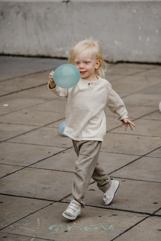 a little girl that is playing with a ball, by Nina Hamnett, dribble, happening, street wears, beige, ‘luca’, square