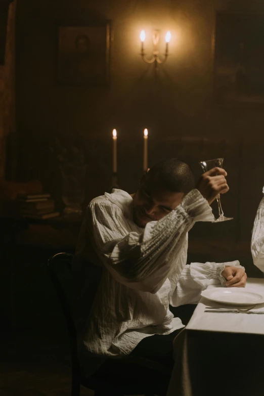 a couple of people that are sitting at a table, inspired by Pietro Longhi, pexels contest winner, renaissance, andrei tarkovsky scene, still from a music video, priest, victorian era