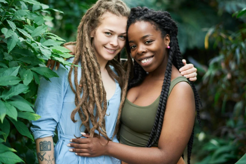 a couple of women standing next to each other, pexels contest winner, renaissance, dreadlock hair, jamaican vibe, lesbian embrace, lush flora