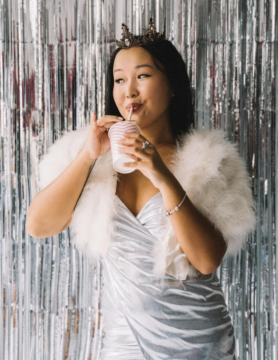 a woman in a silver dress drinking a drink, inspired by helen huang, happening, with white fluffy fur, jackie tsai style, milkshake, profile image