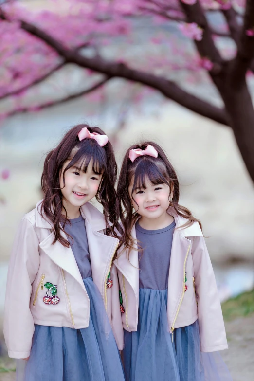 two little girls standing next to each other, a picture, instagram, shin hanga, avatar image, jacket, sakura bloomimg, trending on pinteresst