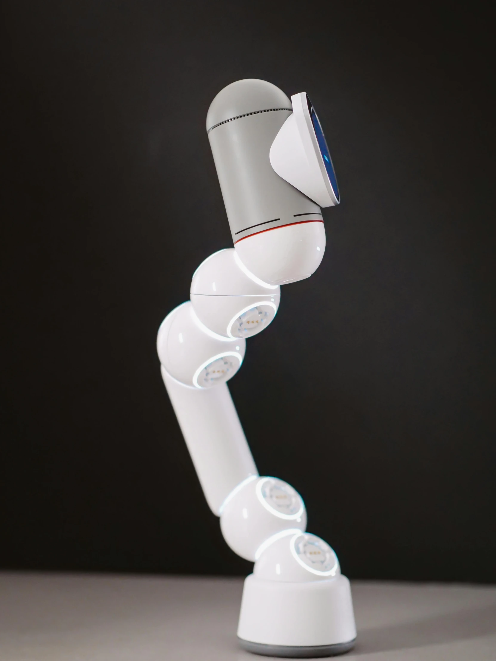 a robotic arm holding a toothbrush on top of a table, a 3D render, by Ben Zoeller, curvy build, 3 d render n - 9, display”, connected with glowing tubes 8 k