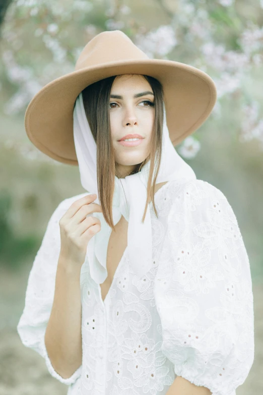 a woman in a hat is posing for a picture, white outfit, long hair shawl, julia sarda, portrait image