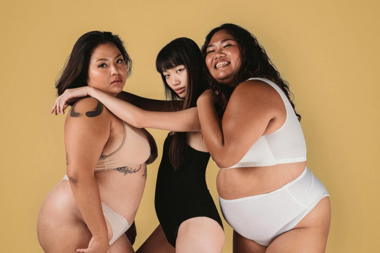 a group of three women standing next to each other, inspired by Ren Hang, trending on pexels, renaissance, curvy body, skincare, half asian, wearing a white bikini