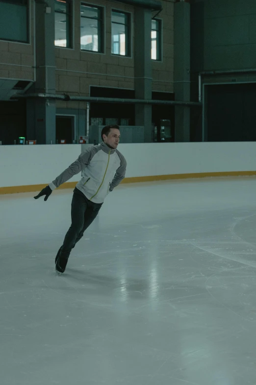 a man is skating on an ice rink, inspired by Daniël Mijtens, arabesque, **cinematic, lachlan bailey, aerodynamic, 8 k movie still