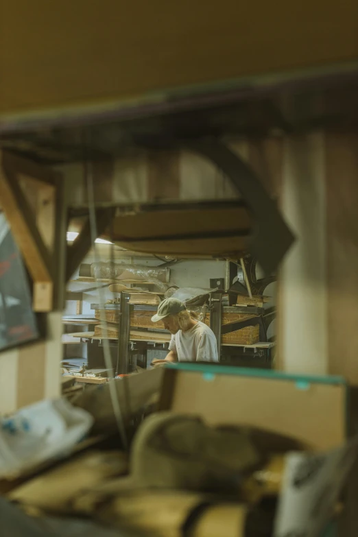 a man that is standing in front of a mirror, in a workshop, cinematic shot ar 9:16 -n 6 -g, panoramic view of girl, crafting