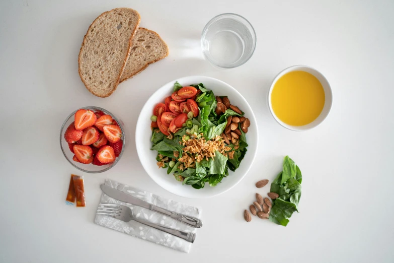 a white table topped with a bowl of food, a photo, by Adam Marczyński, greens), detailed product image, full body image, breakfast