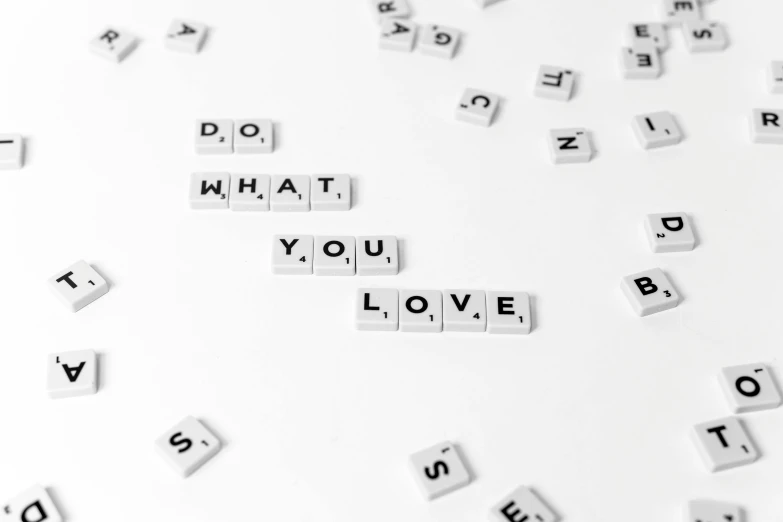 the words do what you love spelled in scrabbles, a picture, by Emma Andijewska, pexels, white background wall, background image, squares, 3 4 5 3 1