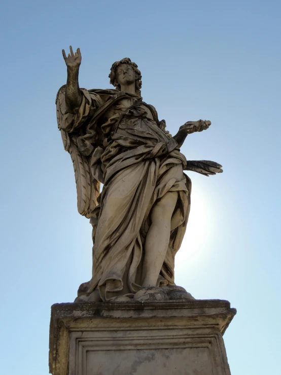 a statue of an angel on top of a building, by Cagnaccio di San Pietro, praising the sun, shrugging arms, persephone, lit from the side