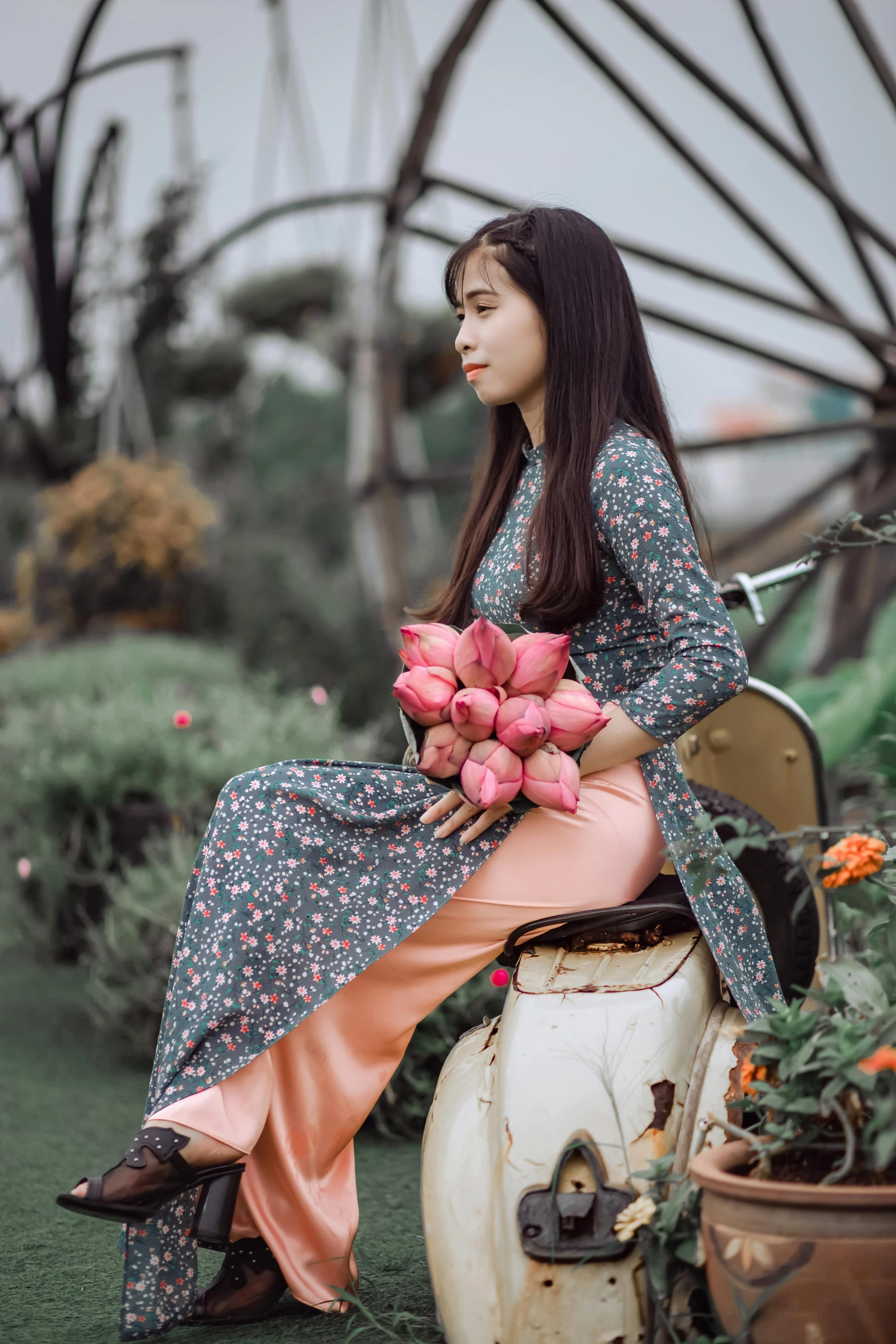 a woman sitting on a chair holding a bunch of flowers, inspired by Ruth Jên, pexels contest winner, ao dai, pants, teenage girl, islamic