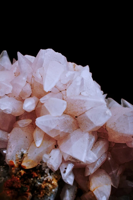 a cluster of pink crystals sitting on top of a rock, slide show, subtle detailing, whites, close-up product photo