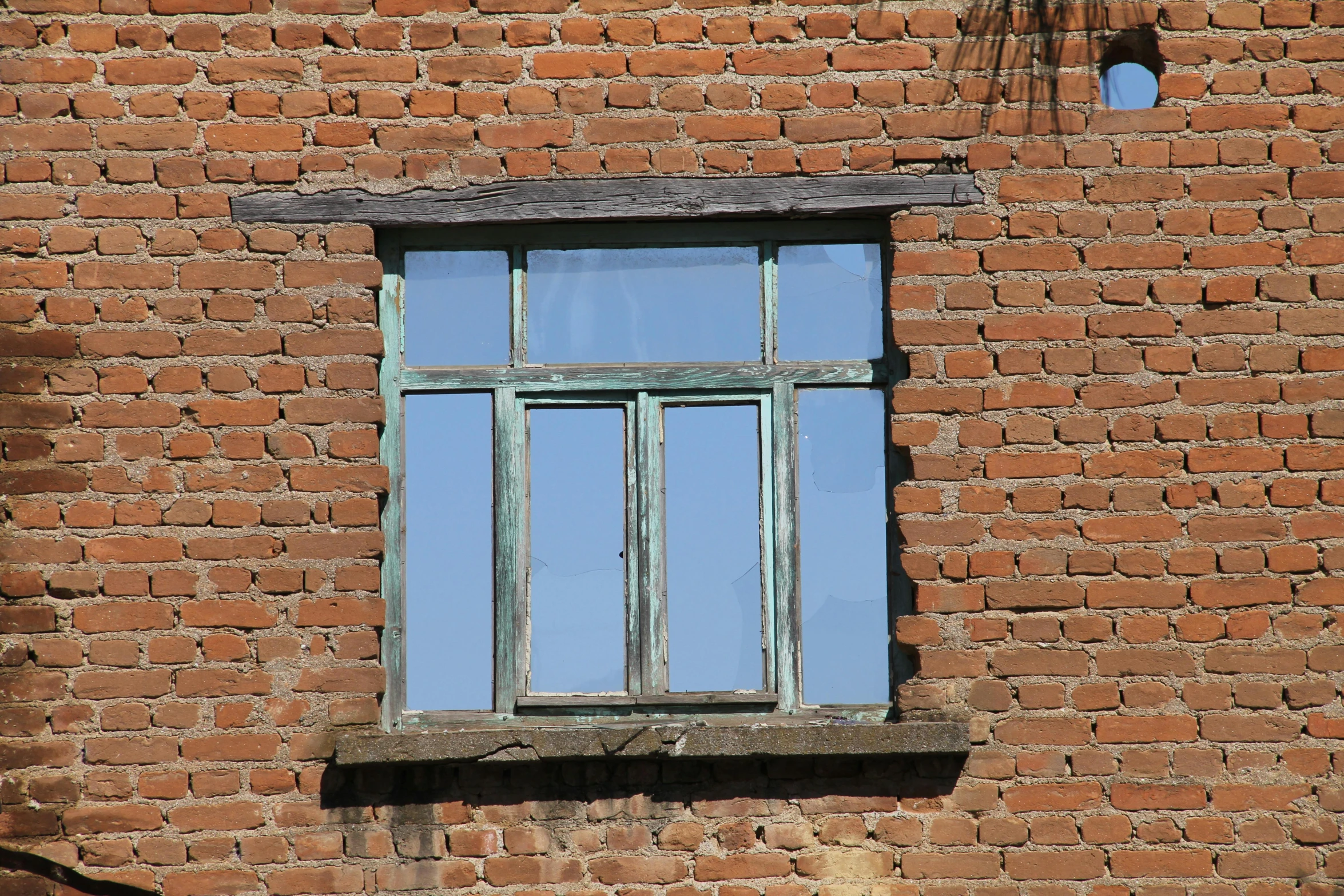 a window on the side of a brick building, by Attila Meszlenyi, pixabay, modernism, levitan, light blues, copper patina, on a village