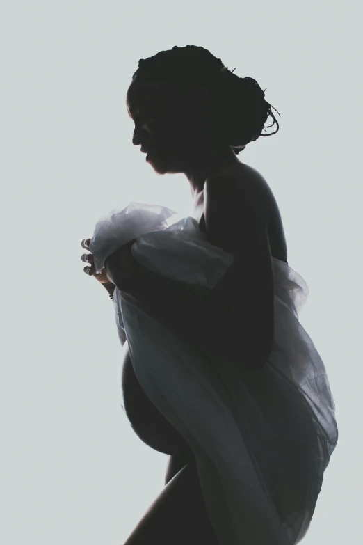 a black and white photo of a pregnant woman, an album cover, pexels contest winner, pastel palette silhouette, silhouette :7, - photorealistic, birth