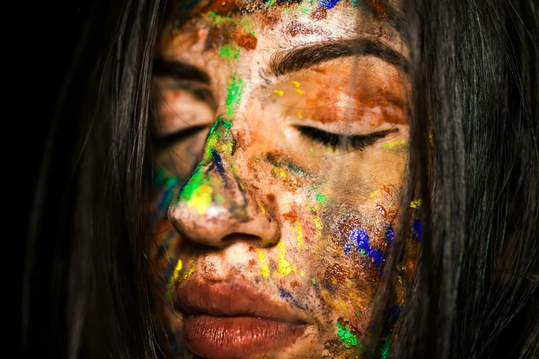 a woman with paint all over her face, a photorealistic painting, trending on pexels, art photography, grungy; colorful, with brown skin, full body close-up shot, detailed unblurred face