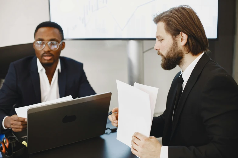 two men sitting at a table in front of a laptop computer, pexels contest winner, royal commission, varying ethnicities, lawyer, slightly minimal