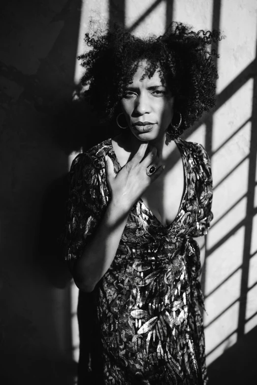 a black and white photo of a woman in a dress, afro, brightly lit, ((portrait)), lizard king / queen forgiveing