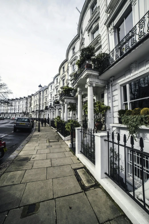 a street filled with lots of tall white buildings, by Rachel Reckitt, shutterstock, neoclassicism, richly decorated victorian house, britain, square, grazing