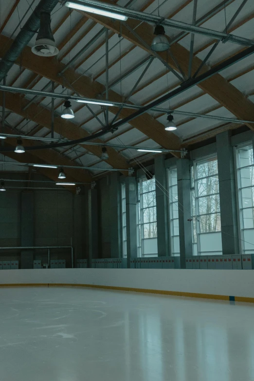 an empty skating rink in a large building, a cartoon, unsplash, light and space, athletic footage, slate, ca