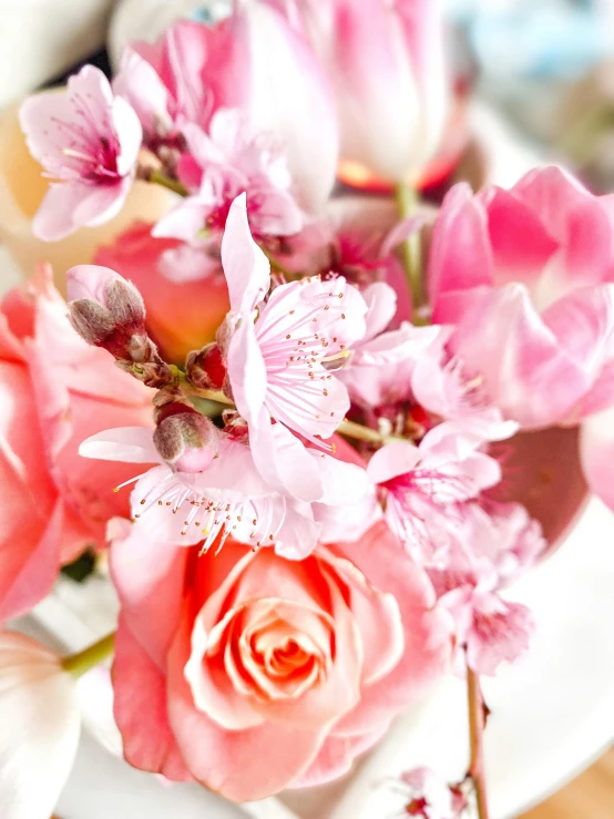 a vase filled with pink flowers on top of a table, up-close, zoomed in, detailed product shot, bouquet