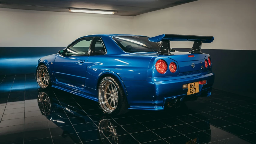 a blue sports car parked in a garage, a portrait, by Kev Walker, unsplash, shin hanga, nissan gtr r 3 4, “ full body, sports car in the room, 2000s photo