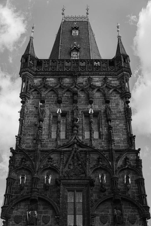 a black and white photo of a clock tower, inspired by Emil Fuchs, prague, stone facade, july 2 0 1 1, hell gate
