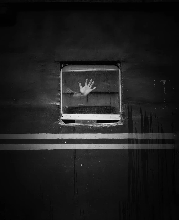 a black and white photo of a hand in a window, by Lucia Peka, graffiti, train far, anton semenov, album, square