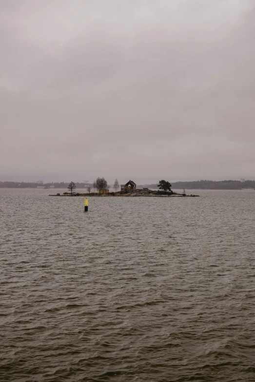 a small island in the middle of a large body of water, inspired by Wilhelm Marstrand, overcast!!!, stockholm, deserted