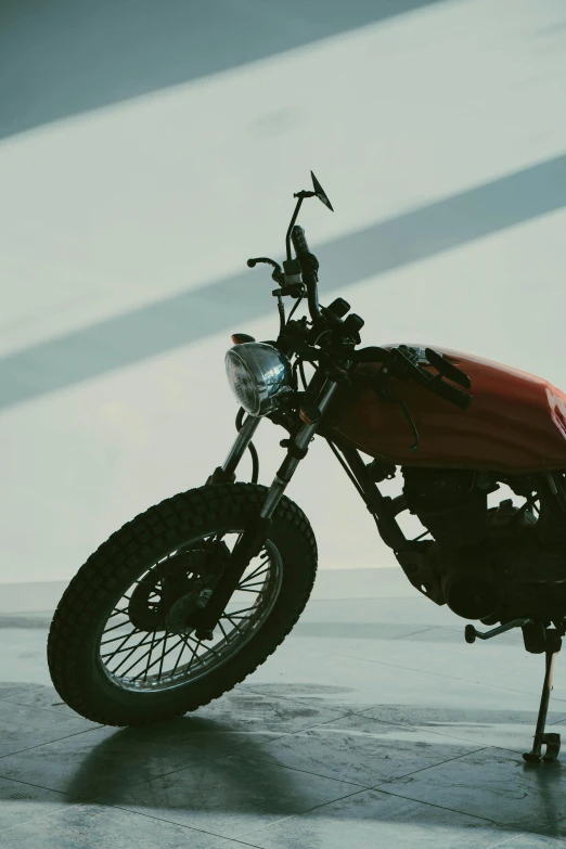 a red motorcycle sitting on top of a cement floor, profile image, on display, octane renter, vehicle